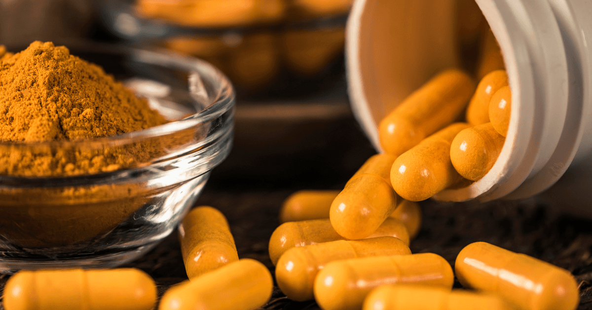 Curcumin supplement capsules and turmeric powder